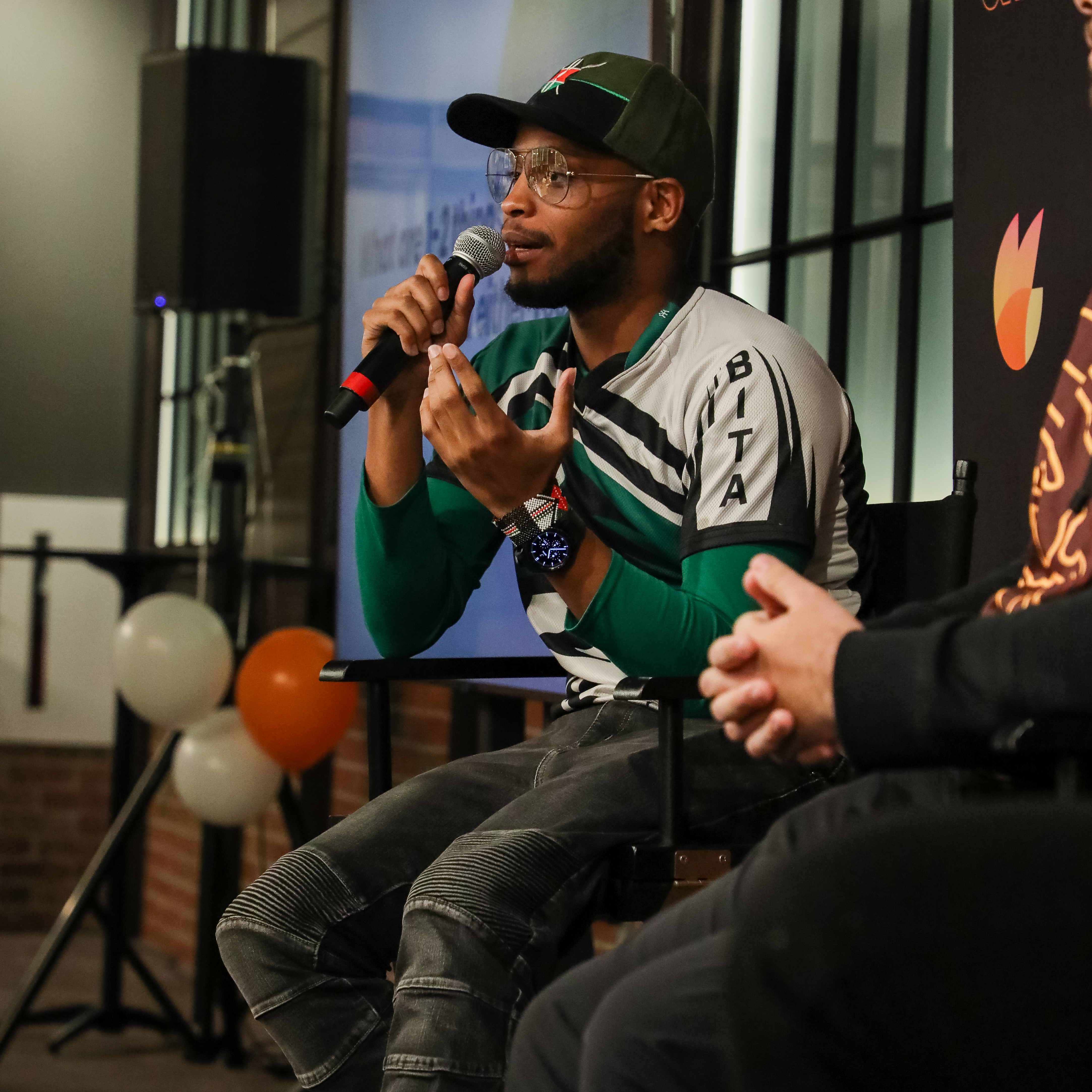Coach Guama speaking at an esports panel
