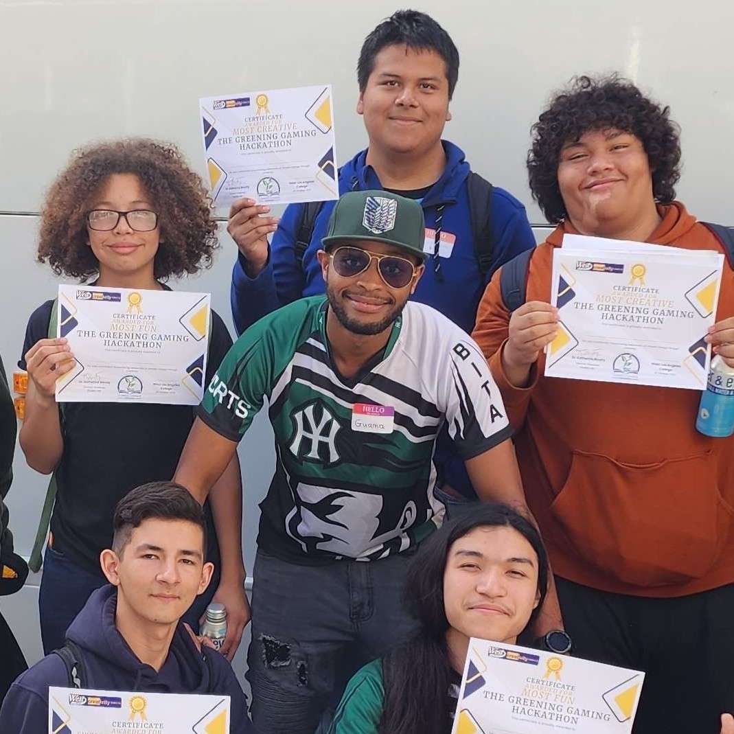 Coach Guama with students at the West LA College esports field trip