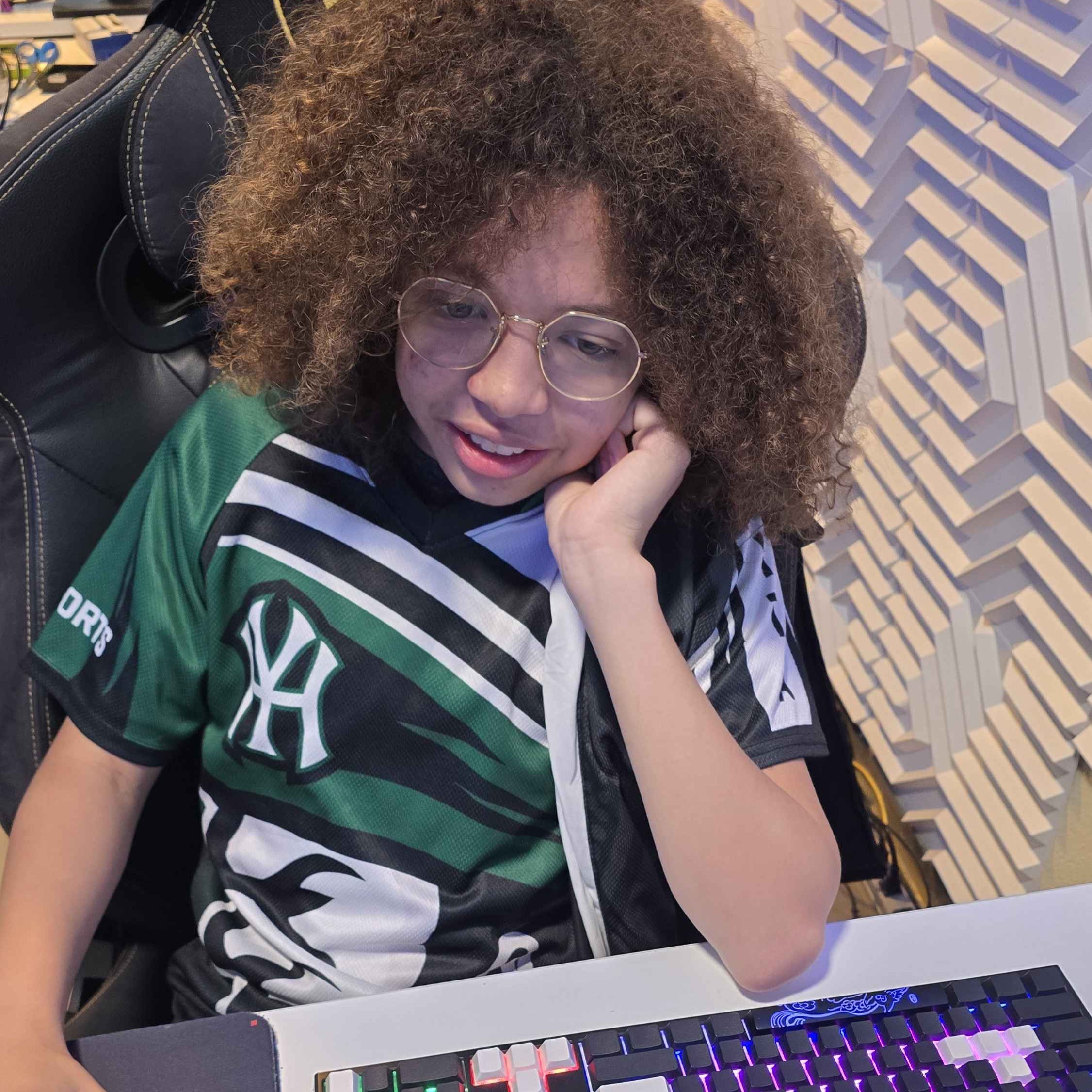Player gaming at a PC station